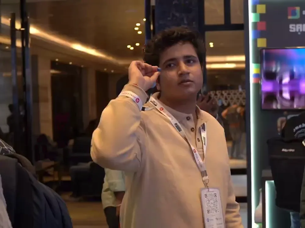 An attendee visiting an exhibitor booth at India Blockchain Week 2023